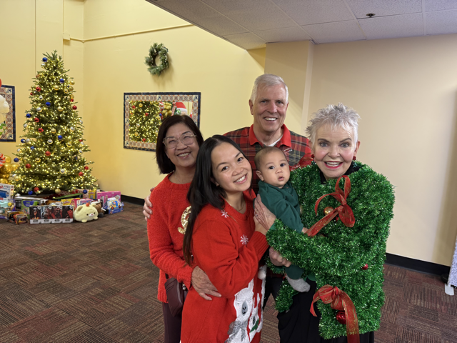 Senator Umberg and Brigadier General Robin Umberg, USA (ret.) with community member at holiday toy drive and party.